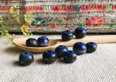 A set of 10 ethnic Yak horn beads (tinted blue) coming directly from Nepal. These are made entirely by hand and are inlaid with Turquoise and brass wire. They are very original. In Nepal they are often used for making necklaces or bracelets. They will be used for all types of creations. Sold by: Lot of 10 pearls Size available: 8mm or 10mm Shipping will be careful and fast! Visit the Nepalmashop.fr store for more choices in ethnic beads and jewelry! Namaste! Blue Wooden Beads For Festival, Artisan Blue Wooden Beads, Traditional Blue Jewelry With Wooden Beads, Blue Bohemian Beads For Festive Occasion, Bohemian Blue Beads For Festive Occasions, Artisan Wooden Beads For Festivals, Traditional Large Blue Beads, Traditional Blue Wooden Beads, Traditional Turquoise Wooden Beads