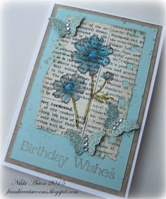 a birthday card with blue flowers on it