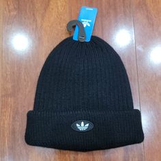 Nwt Unisex 100% Acrylic Black Ribbbed Knit Hat With Turnback Cuff Accented By White Adidas Logo. Style Is Mini Fit. Knitted Hats For Streetwear, Black Cotton Knitted Beanie, Casual Hats For Winter Sports, Black Knitted Beanie For Winter, Casual Hat For Winter Sports, One Size Fits Most, Urban Black Beanie For Streetwear, Black Knitted Hat For Streetwear, Black Ribbed Beanie For Winter, Black Ribbed Winter Beanie