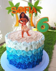 there is a cake that has been made to look like moan the hula girl