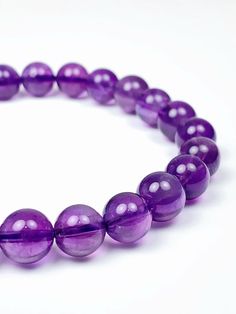 PhoebeArt Grade AA Genuine natural Amethyst Smooth Round beads Stretch Bracelet  Certificate 100% natural gemstone without any chemical addition treatment Gemstone: Natural  Amethyst , not synthetic gemstones Bead size:  8mm Length: 7.5" + 2 beads ( each bracelet add 2 beads for growth )  Hole size: +- 1 mm Shape: Smooth Round Color: Light purple Beaded Stretch Bracelet, Purple Amethyst, Stretch Bracelet, Light Purple, Stretch Bracelets, Color Light, Round Beads, Natural Light, Favorite Jewelry