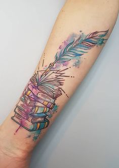 a watercolor tattoo with books and an arrow on the left side of the arm