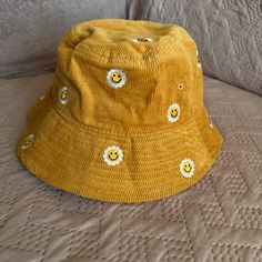 New Without Tags. This Is An Adult Size Hat. Super Cute Embroidery And Pretty Mustard Yellow Color. Fun Yellow Bucket Hat For Spring, Cute Adjustable Yellow Bucket Hat, Adjustable Cotton Hat With Smiley Face, Cute Yellow Adjustable Bucket Hat, Adjustable Yellow Cotton Hat, Yellow Cotton Bucket Hat For Spring, Spring Yellow Cotton Bucket Hat, Cute Yellow Winter Hat, Yellow Adjustable Cotton Bucket Hat