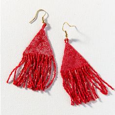 Part of Ink + Alloy's luxe collection accessories, the scarlet luxe earring with fringe is hand crafted by artisans in India. Delicate glass beads with an elegant shimmer are woven for a luminous and effortlessly cool beaded statement accessory - a must for those who love their everyday delicates with a touch of evening elegance. Red Bead Earrings, Fringe Earring, Ivory Earrings, Light Weight Jewelry, Red Boho, Beaded Drop Earrings, Holiday Red, Red Earrings, Beaded Fringe