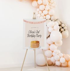 a birthday party sign surrounded by balloons