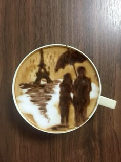 a cappuccino with the eiffel tower painted on it