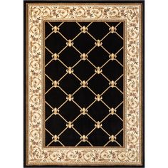 a black rug with gold trimmings and an ornate design on the bottom corner