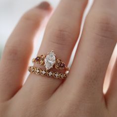 This stunning ring features a marquise cut center stone between two intricate golden staves, which were inspired by Sailor Pluto's staff from my favorite manga series, Pretty Guardian: Sailor Moon. CUSTOMIZE GEMSTONES ✶ solid 14 karat recycled yellow, white, or rose gold✶ band measures 1.5mm wide x 1.4mm thick✶ natural diamond option: 0.70 ct. VS1 clarity, GHI color, VG cut, VG polish natural conflict-free marquise-cut diamond - GIA report included✶ lab-grown diamond option: 0.70 ct. VS1 clarity Talisman Ring, Pretty Guardian Sailor Moon, Marquise Cut Diamond, Rose Gold Band, Marquise Cut, Pretty Jewellery, Pink Sapphire, Gemstone Colors, Gold Bands