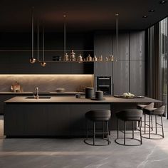 a kitchen with an island and bar stools next to the counter top in front of a large window