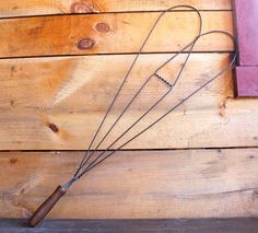 a bunch of wire on top of a wooden floor next to a wall with a window