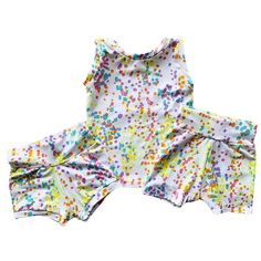 These white shorts with neon dots are SO much fun, so soft and oh so cute. Grab a matching tank top HERE Choose between the two styles- "Shorties" or "Longer Shorts". See the below descriptions for the difference between them. Shorts have a separate waistband and are a mid-length. They end just above or around the knee, depending on the child's height. Shorties have a separate waistband, and tiny cuffs at the bottom of the leg section. They are not slim fit, but not loose either. They end mid thigh to show some of that cute baby thigh we all adore. Cute Summer Playwear Shorts, Playful Summer Shorts, Playful Yellow Summer Shorts, Multicolor Playtime Shorts For Spring, Multicolor Spring Shorts For Playtime, Playful Stretch Shorts For Spring, Playful White Fitted Shorts, Playful White Shorts, Playful Fitted White Shorts