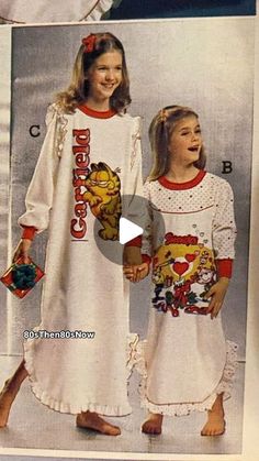 two girls in pajamas and dresses standing next to each other