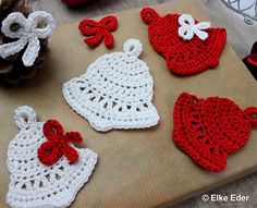 crocheted items are displayed on a cutting board, including an ornament