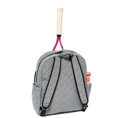 a back pack with a tennis racket sticking out of it's side pocket