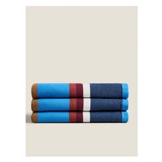 three towels stacked on top of each other in blue, red and brown colors with white stripes