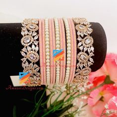 Pink Bangle Set With Rose Gold American Diamond Kadas. Shipped FREE from Canada to USA, Europe, Italy, Norway, Spain and everywhere else. 📦 Unmatched FREE Worldwide Shipping Explore more INDIAN BANGLES, Indian Kada, CHURA, Bridal Kada 👉 PUNJABI BRIDAL JEWELLERY ONLINE 🛒 AMERICAN DIAMOND JEWELRY Pushpinder, Canada ⭐️⭐️⭐️⭐️⭐️ Amazel Designs products are beyond the expectations 😇Just awesome like them. I ordered couple of things for my wife. Thanks for the quick and fast delivery 😊 Aisha, Cana Bridal Jewellery Online, Indian Bangles, Europe Italy, American Diamond Jewellery, Chur, Bangles Indian, Bridal Jewellery, American Diamond, Bangle Set