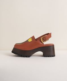 The CS x Lorien Stern collab version of our best-selling Carlos clog. All of the same winning features of Carlos: 2.75" heel, and 1.25" platform, 90's style squarish toe, leather uppers, slingback with an oversize buckle, rubber treaded outsoles—plus Lorien's classic tulips in a sweet leather cutout. She's retro and current, sweet and salty, CS and LS. Lorien Stern, Stone Boots, Chunky Clogs, Bryr Clogs, Venus In Capricorn, Charlotte Stone, Black Tulips, Platform Clogs, Cottagecore Aesthetic