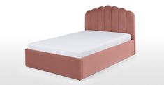 a bed with a pink headboard and white sheets on it's sides, against a white background