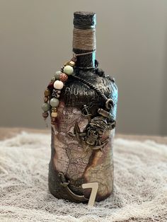 a bottle that has some beads on it