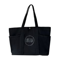 Be prepared for any adventure with our Can Hold It All Tote! This stylish and spacious tote has you covered, keeping everything you need in one place. Say goodbye to digging for your essentials and hello to convenience and organization. Perfect for the on-the-go lifestyle. Black Canvas Bag With Zipper Pocket For Daily Use, Black Canvas Bag With Pockets For Travel, Black Canvas Travel Bag With Double Handle, Large Capacity Black Canvas Bag For On-the-go, Black Canvas Bag With Removable Pouch For On-the-go, Black Canvas Bag With Pockets For On-the-go, Black Rectangular Travel Bag With Pockets, Large Bags With Pockets, Black Canvas Bag With Zipper Pocket For On-the-go