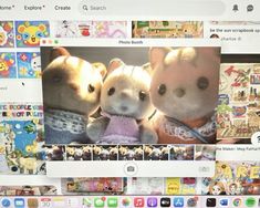 two small stuffed animals sitting next to each other in front of a computer screen with pictures on it