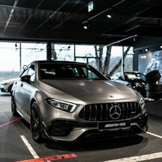 the mercedes amg coupe is parked in a parking lot with other cars behind it