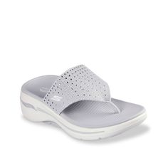 Skechers-GO Walk Arch Fit Glam Wedge Sandal Add a stylish touch to sporty looks with the GO Walk Arch Fit Glam wedge sandals from Skechers. This pair is crafted with comfortable features including a lightweight Ultra GO® cushioning midsole, a contoured comfort footbed, and podiatrist-certified arch support. Complete with a rhinestone-covered upper for a bit of sparkle. Synthetic Wedge Heel Sport Sandals With Arch Support, Synthetic Sport Sandals With Arch Support And Wedge Heel, Synthetic Wedge Heel Sport Sandals With Cushioned Footbed, White Sport Sandals With Arch Support, Comfortable Wedge Sandals With Textured Footbed, Comfortable Synthetic Wedge Heel Sport Sandals, Beach Sport Sandals With Arch Support And Wedge Heel, Summer Slip-on Sandals With Gel Cushioning, White Wedge Sandals With Arch Support