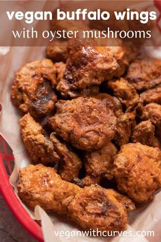 a basket filled with fried food sitting on top of a table