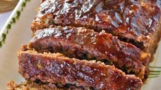 slices of meatloaf on a plate with sauce