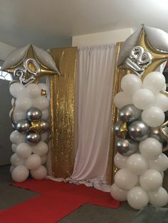 balloon arch with white and silver balloons