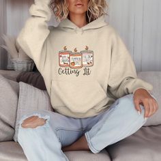 Light up your wardrobe with this fun and cozy Gildan 18500 hoodie featuring a playful three-candle graphic and the phrase "Get Lit" underneath. Perfect for those who love a good laugh and enjoy the warm, cozy vibes of candle season. Made with high-quality fabric, this sweatshirt is ideal for chilly fall days, lounging, or gifting to your favorite candle lover. Whether you're a fan of scented candles or just enjoy the pun, this pullover is sure to keep you warm and stylish. Available in multiple sizes and colors, it's a must-have for fall and winter! This unisex heavy blend hooded sweatshirt is relaxation itself. Made with a thick blend of cotton and polyester, it feels plush, soft and warm, a perfect choice for any cold day. In the front, the spacious kangaroo pocket adds daily practicalit Candle Graphic, Candle Lover, Happy Coffee, Coffee Obsession, Coffee Cup Design, Cozy Pullover, Kangaroo Pouch, Design Element, Fall Vibes