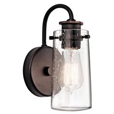 a wall light with a glass shade on it