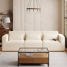 a living room with a white couch and coffee table