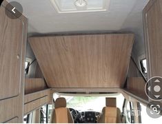 the interior of an rv with wood paneling