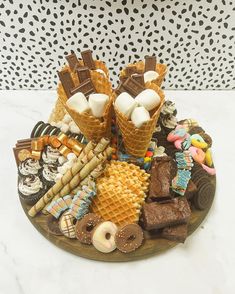 an assortment of desserts on a wooden platter