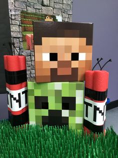 an image of a minecraft man made out of toilet paper and some fake grass