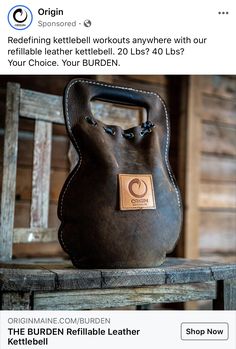 a brown bag sitting on top of a wooden table