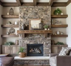 a living room filled with lots of furniture and a fire place in front of a stone fireplace