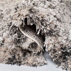 a pile of dirty rugs that have been washed and covered with some sort of cloth