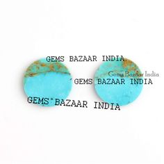 two turquoise colored stones with the words gems bazaar india and gen's bazaar india