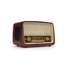 an old fashioned radio sitting on top of a table