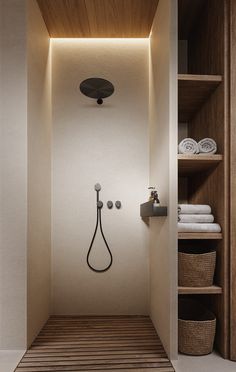 a bathroom with a shower and shelves in it