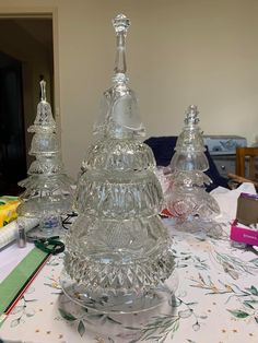 three clear glass items on a table