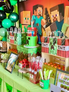 a table topped with lots of candy and decorations