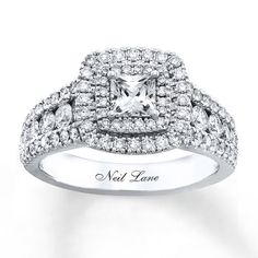 a white gold ring with diamonds on top and the words, not lane written in black ink