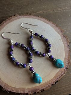 Turquoise earrings boho purple sleeping beauty earrings hoop wire silver dangle handmade stone earrings tribal gift unique jewelry for women Earrings for women. Yes, please. I love to rock a great pair of earrings. Stone, crystal, lampwork, beaded earrings, well I love all of them! These earrings have 4mm purple turquoise, 10mm sleeping beauty natural stone turquoise. Bali beads, Silver wire handmade hoops, Sterling silver ear wires. I haven't been able to get my hands on the real deal for FOUR Bohemian Turquoise Hoop Earrings With Natural Stones, Bohemian Dangle Hoop Earrings With Natural Stones, Bohemian Sterling Silver Wire Wrapped Hoop Earrings, Bohemian Purple Sterling Silver Earrings, Bohemian Purple Wire Wrapped Jewelry, Boho Purple, Beaded Boho Necklace, Lampwork Necklace, Earrings Stone