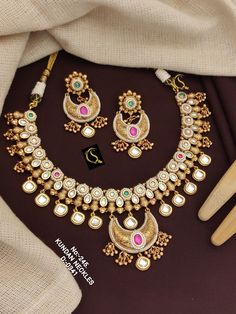 Description :- Amrapali Necklace, Moissanite Polki Necklace Set, Yellow Necklace, Mint Green Necklace, Party Wear, Festive Wear, Designer Necklace, Wedding Gift yourself a royal look with this perfectly crafted kundan necklace set from Manalisstudio. Crafted with high quality kundan stones and pearls, it is impressive in design. The green enamel artwork adds perfect texture to the design. Perfect for weddings and festivities, this antique necklace set should be put on with your favorite sari or Kundan Necklace With Tilla For Anniversary And Festivals, Anniversary Kundan Necklace With Tilla Detailing, Bollywood Style Round Necklaces For Reception, Cutdana Necklaces For Receptions, Traditional Kundan Necklace With Tilla For Anniversary, Heavy Kundan Bridal Necklace For Anniversary, Traditional Kundan Bridal Necklace For Anniversary, Traditional Heavy Necklace For Anniversary, Round Necklaces For Receptions And Festivals