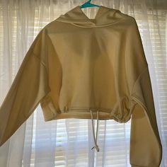 Brand New Only Worn Once! Cream Yellow Cropped Hoodie From Shein. No Stains, No Defects. Good For Spring/Fall ! Super Cozy! Has A Tie Feature For A More Contoured Look If You Wanted. Only Worn To Try It On, I Bought It For $15 And Will Sell For $10, Price Is Firm. Spring Fleece Stretch Hoodie, Spring Stretch Sweater With Drawstring Hood, Spring Sweater With Drawstring Hood, Spring Fleece Sweater With Drawstring Hood, Cozy Spring Sweatshirt With Drawstring, Cozy Drawstring Sweatshirt For Spring, Cream Hooded Hoodie For Spring, Spring Fleece Hoodie Top, Spring Cream Hooded Sweatshirt