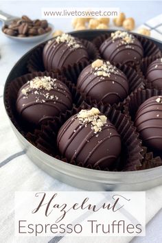 chocolate truffles in a metal pan on a table with nuts and text overlay