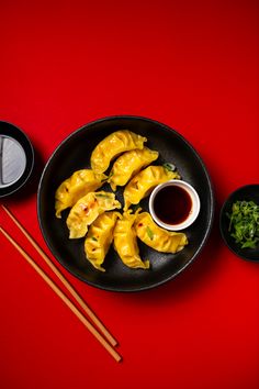 Plate of dumplings and soy sauce on red backdrop Dumplings Food Photography, Momo Photography, Dumplings Photography, Dumplings Aesthetic, Nepal Food, Asian Food Photography, Restaurant Branding, Chinese Restaurant, Spicy Recipes